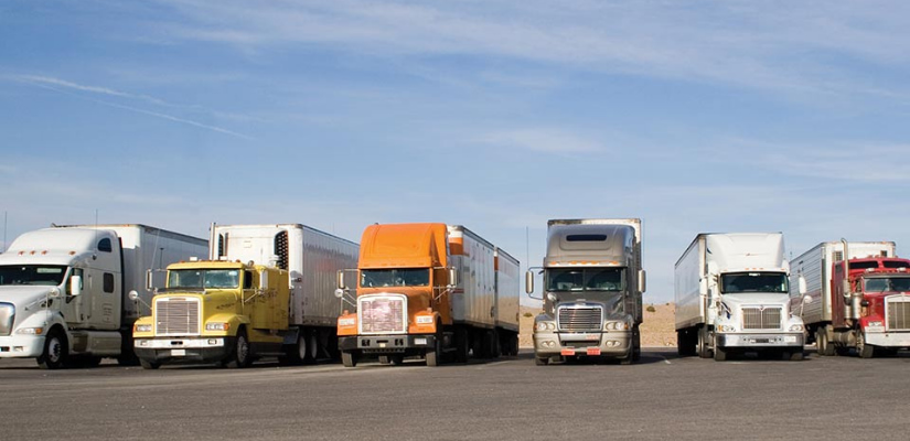 Line up of long haul trucks