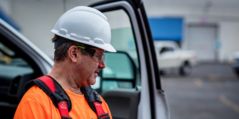 Technician getting out of a vehicle